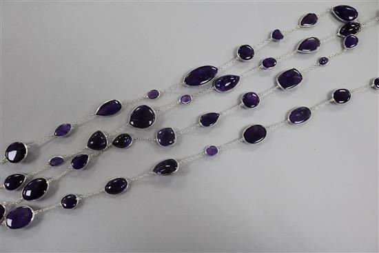 A modern silver and amethyst long necklace, set with various cut amethyst stones, 194cm.